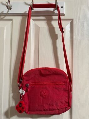 Kipling Bright Red Crossbody Bag with Signature Monkey Charm